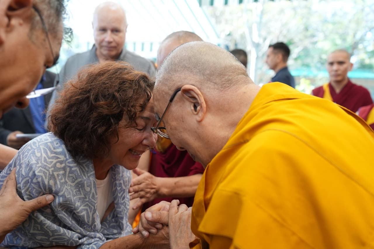 Cynthia sharing a heartfelt moment during a spiritual gathering